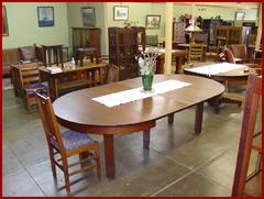 Partial view of the "Craftsman Antique" side of the shop, table shown with all four leaves installed.